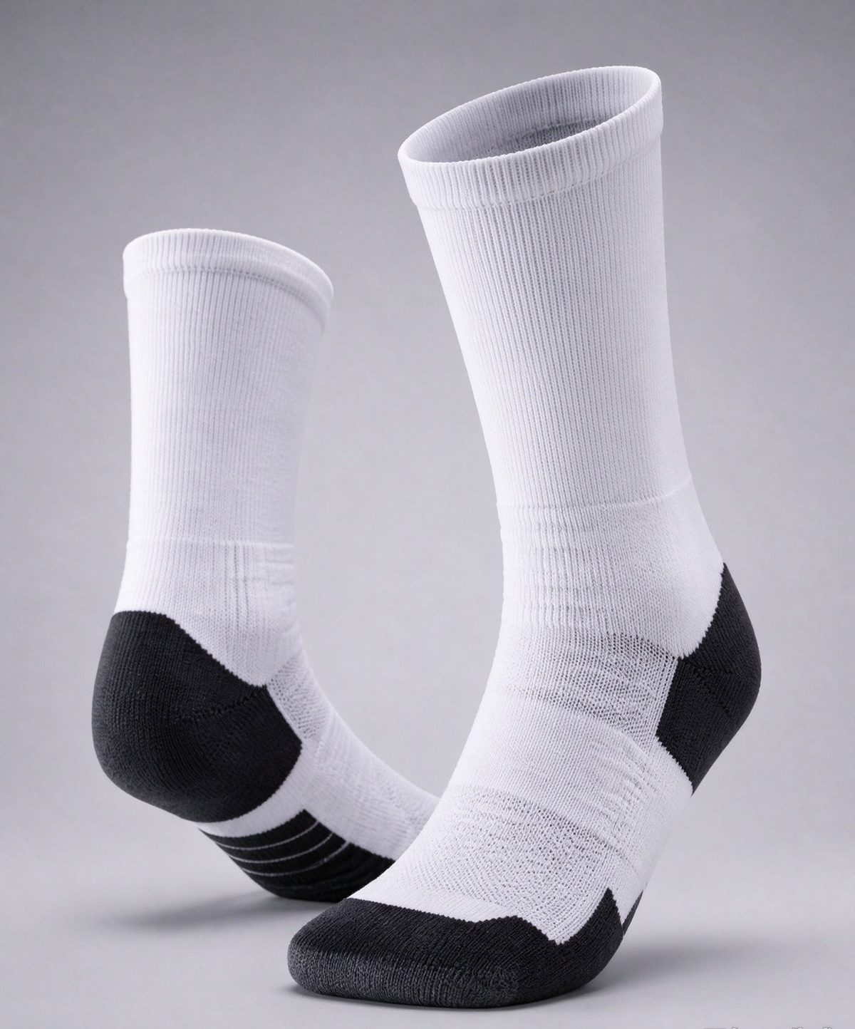 White athletic crew socks with black cushioned heel and sole